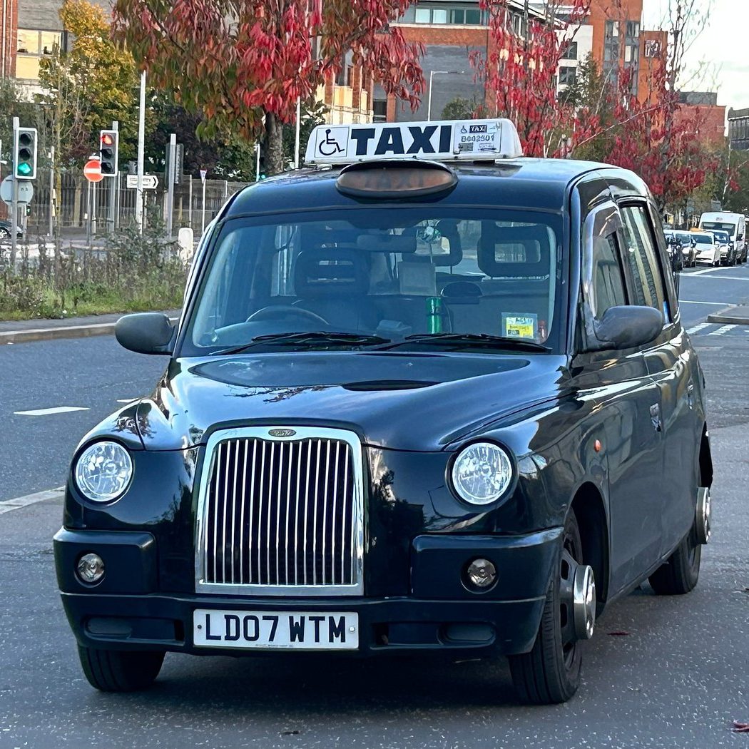 Taxi on Belfast Tour Black taxi cab on Falls Road Belfast Taxi on Belfast Tour